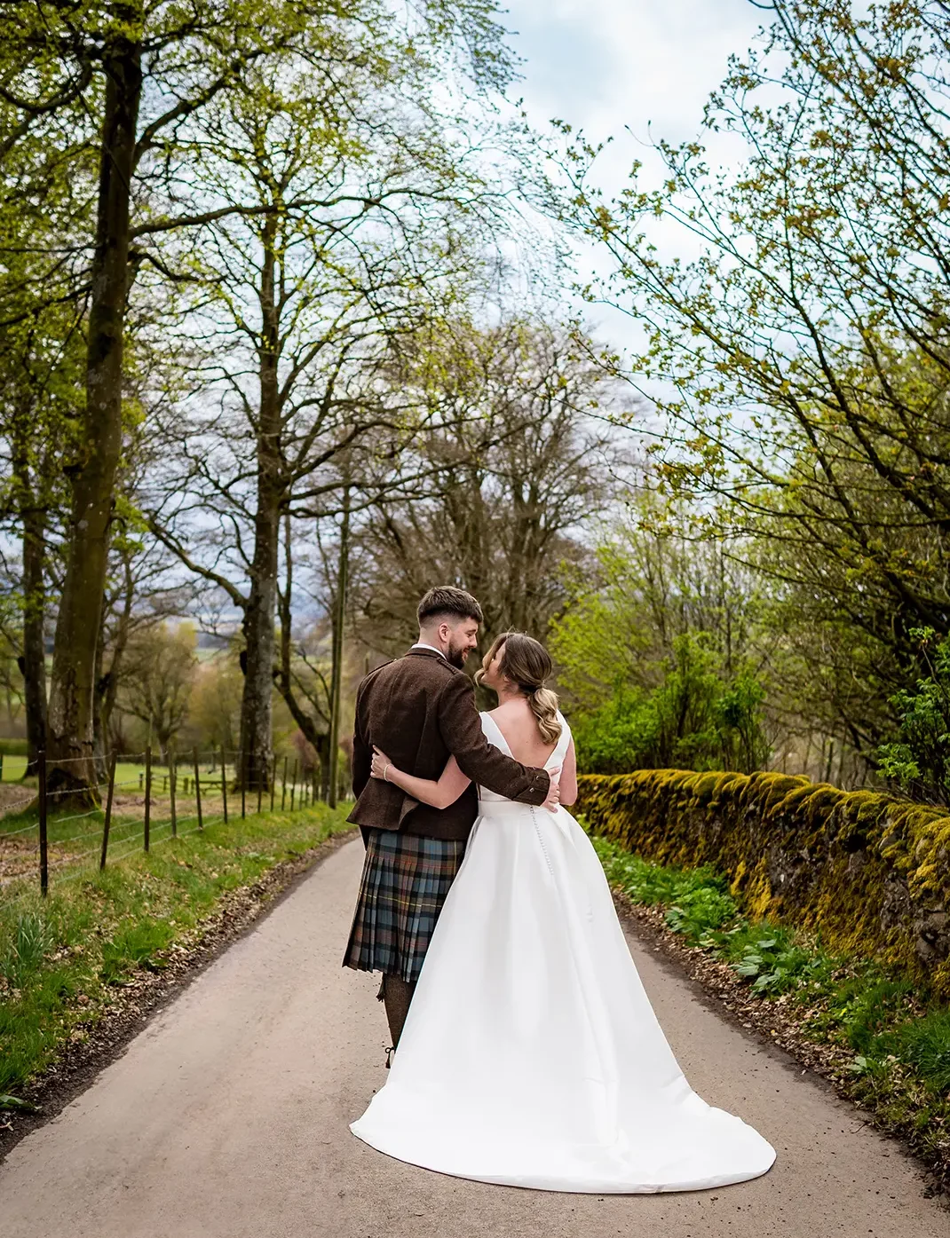 Bride and Groom on Kinclune Estate in the Angus Glens. Wedding dress by The Hitching Post Bridal