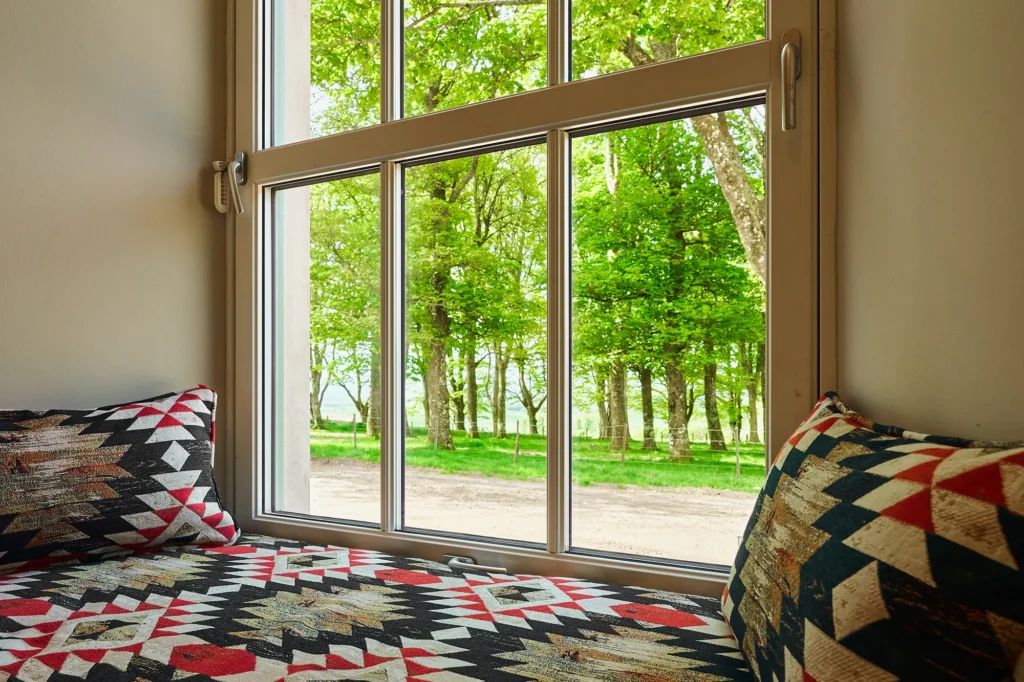 The window seat in bedroom 2 with views across woodland.