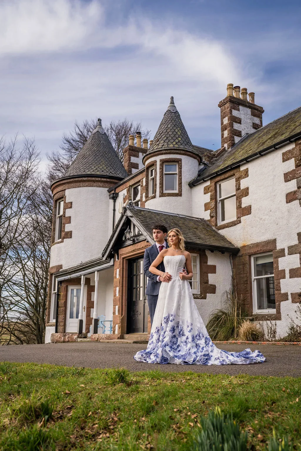 Bride and groom outside Kinclune House in the Angus Glens. Dress by The Hitching Post Bridal. Photography by ZibiZPhoto.