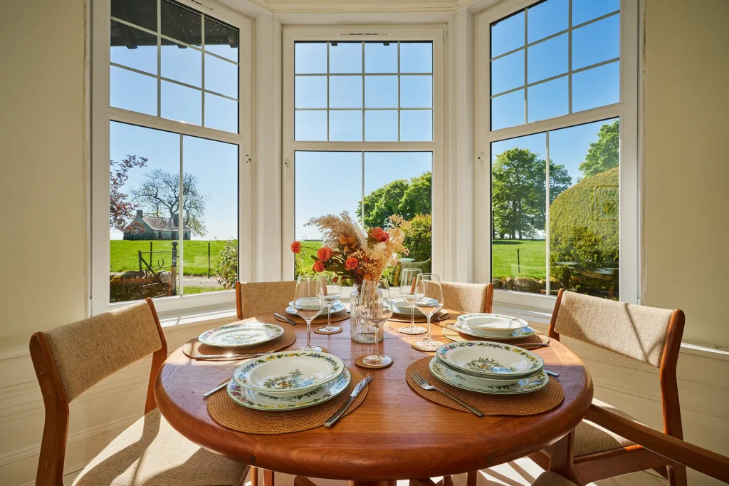 The dining area is set within the feature bay window and offers beautiful views across the estate