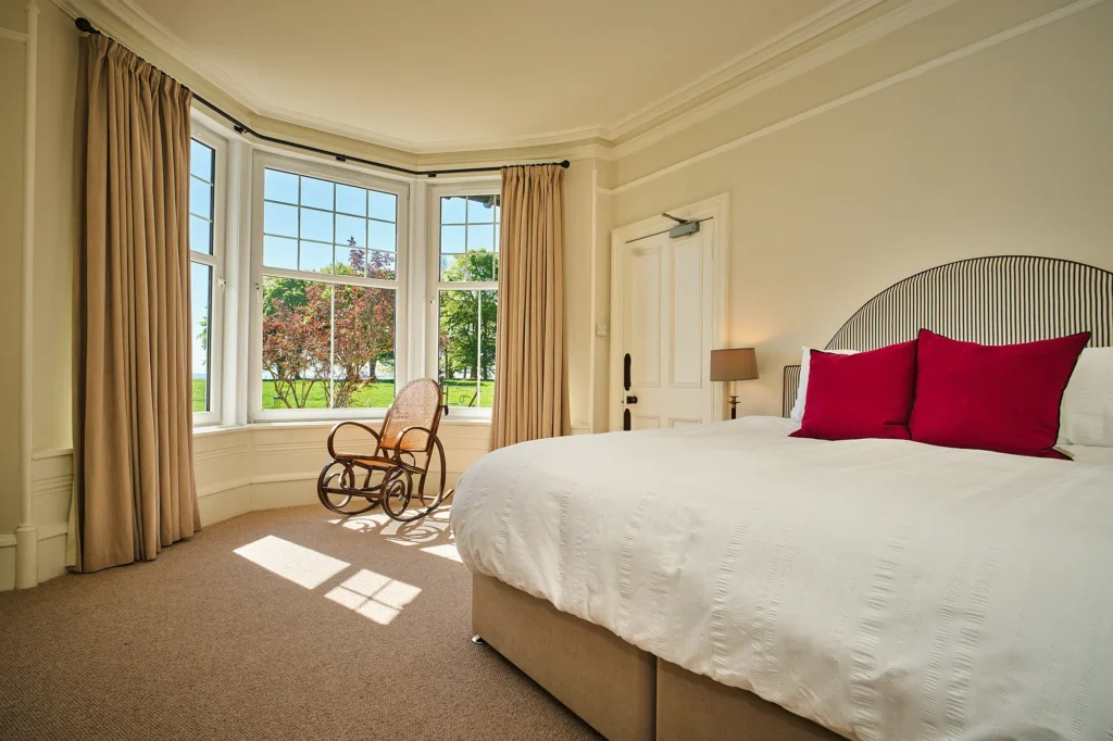 Grieve's ground floor master en-suite bedroom with feature bay window and views across the Vale of Strathmore