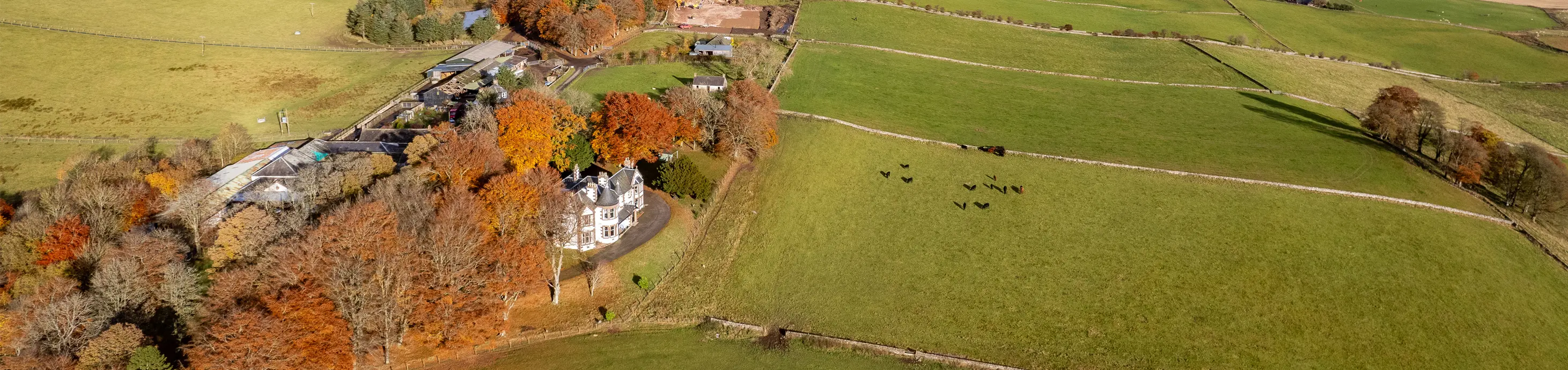 Kinclune House and steading in autumn aerial view