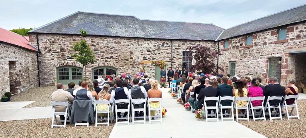 Claire and Jamie's courtyard wedding ceremony at Kinclune Steading in Angus