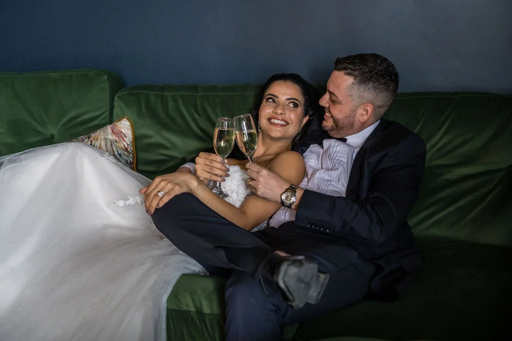 Bride and groom enjoying a quiet moment in the cosy snug at Kinclune House. Dress by The Hitching Post Bridal. Photography by ZibiZPhoto.