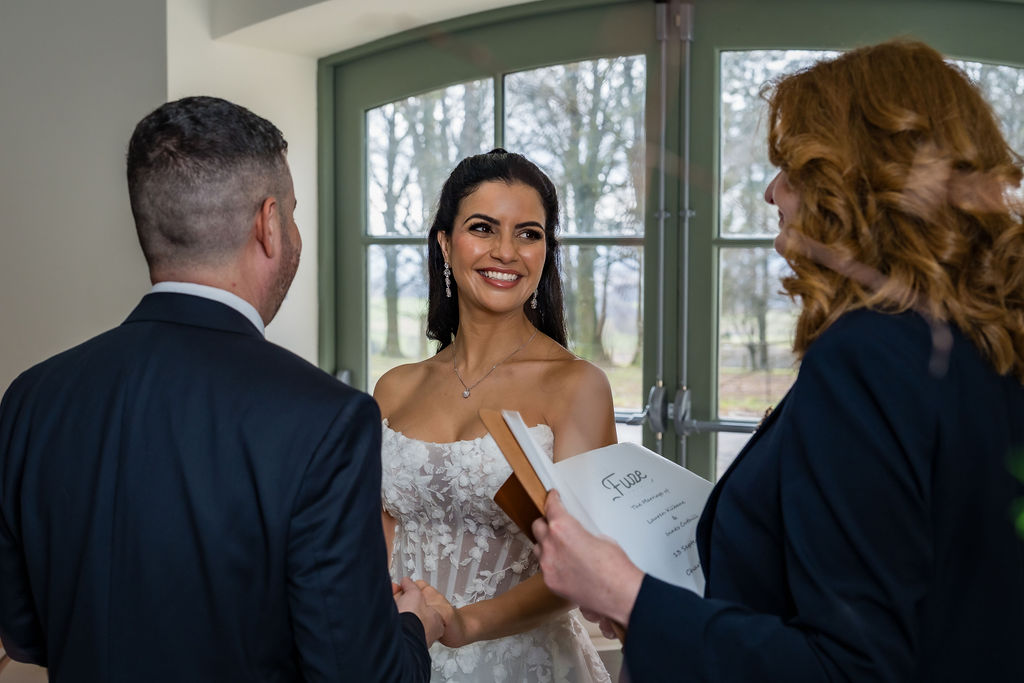 Wedding ceremony in The Arches at Kinclune, overlooking woodland. Dress by The Hitching Post Bridal. Photography by ZibiZPhoto.